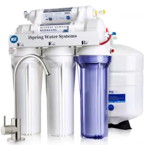 A reverse osmosis system with visible filter housings installed under a sink.