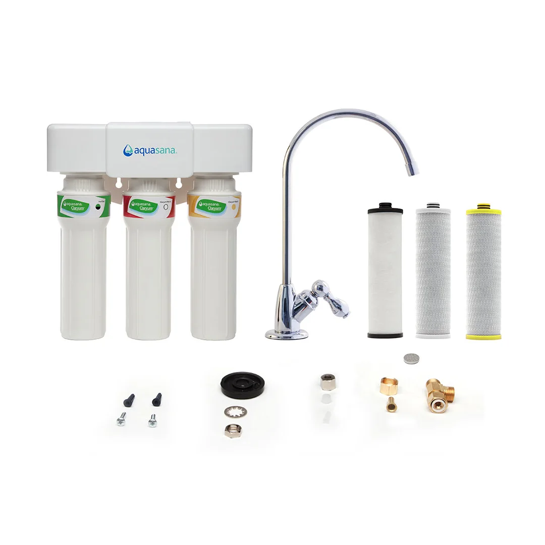 A whole-house water filter unit beside pipes in a home utility room.